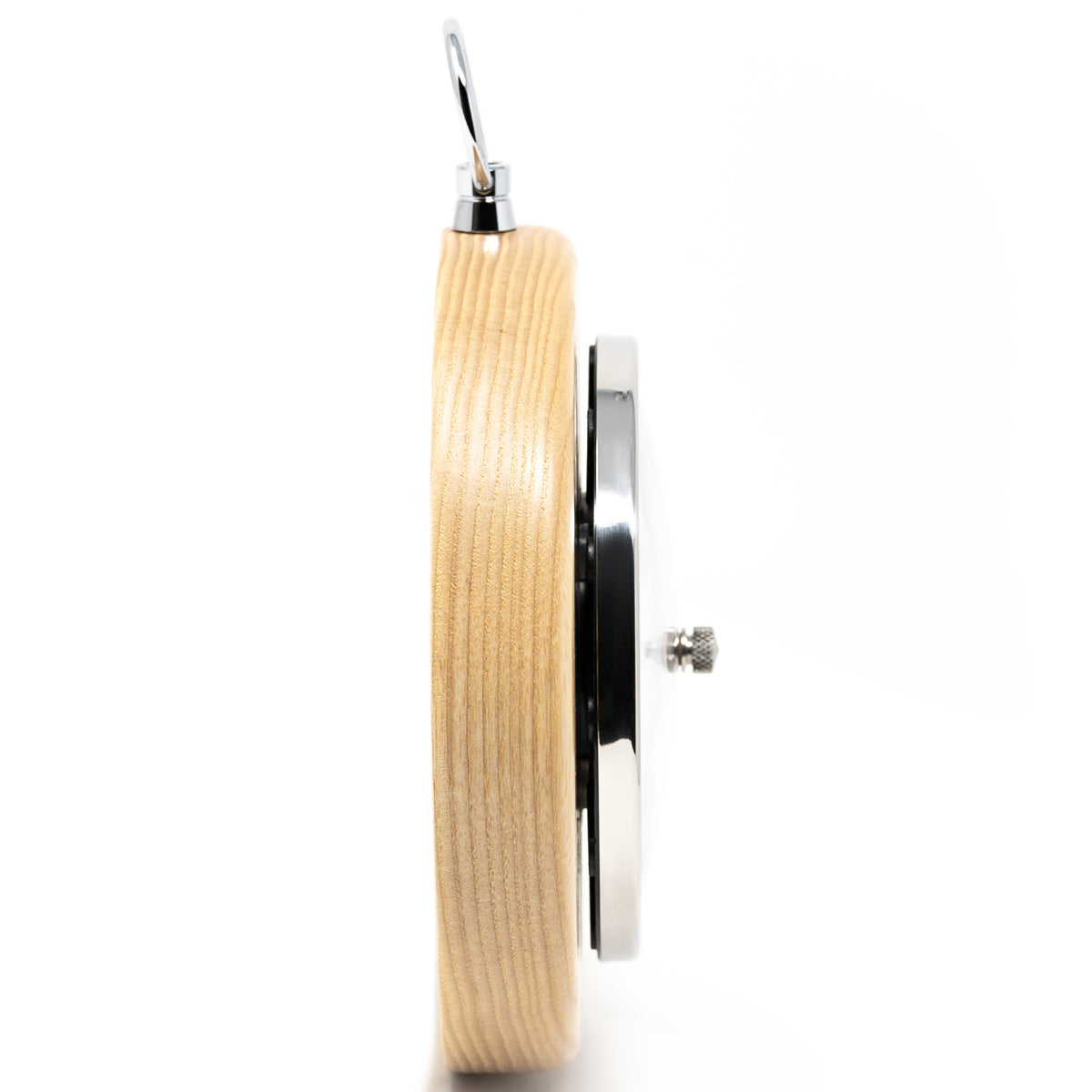 Side view of a round wooden barometer with metal trim and hanging hook, isolated on white