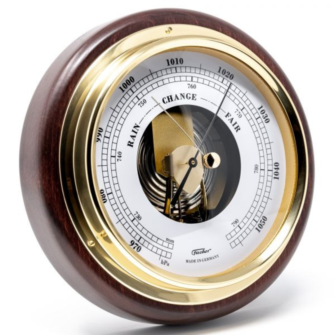 German analog barometer with brass bezel and wooden frame for weather measurement