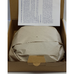 Cardboard box with wrapped barometer or clock, packaging insert on lid