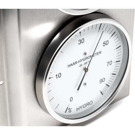 Close-up of a German-made analog hair hygrometer with stainless steel frame, measuring humidity.