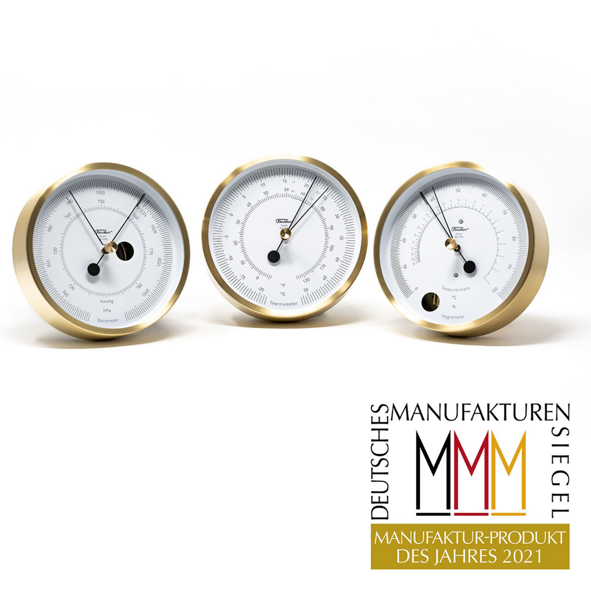 German brass barometer, thermometer, and hygrometer set on white background, award logo displayed