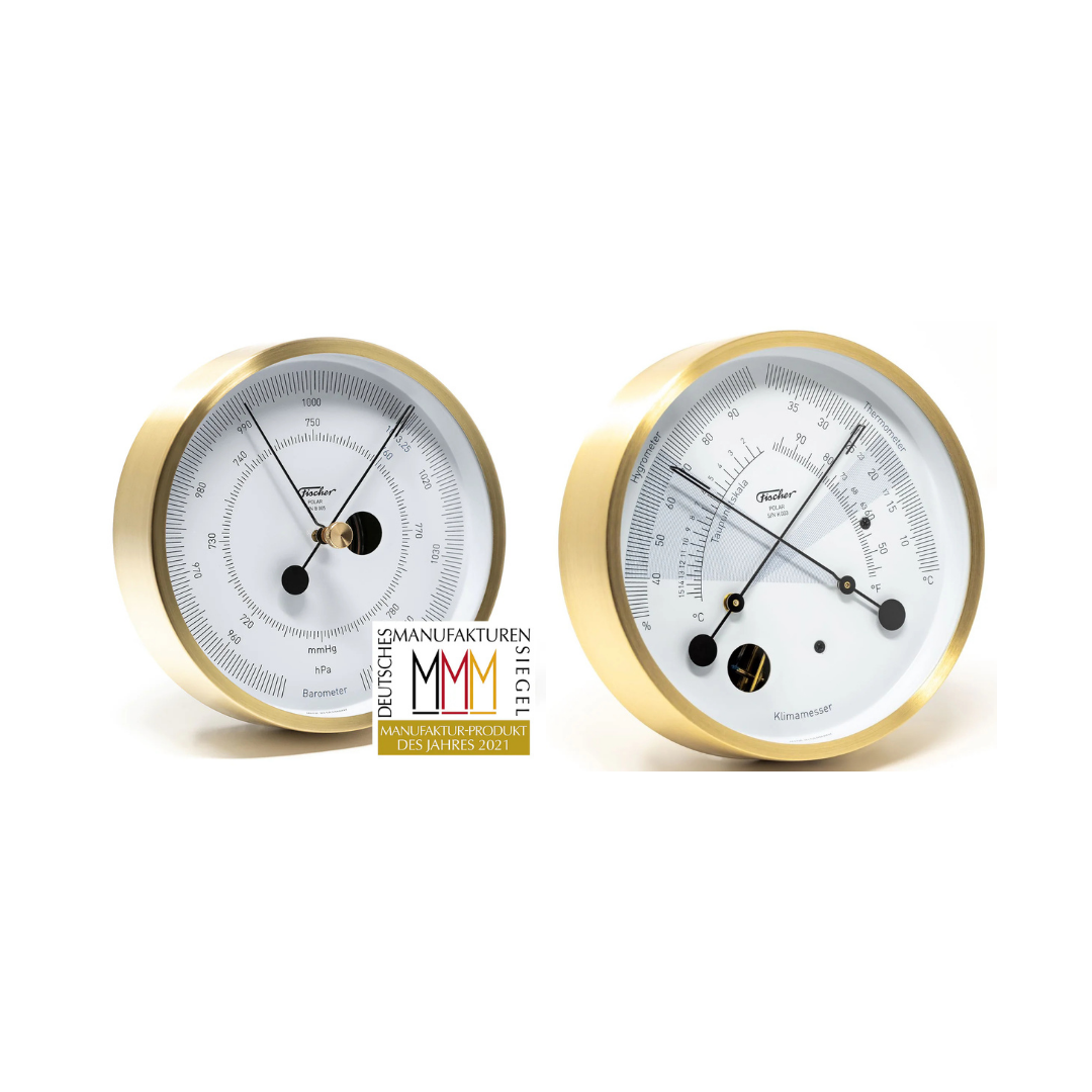 German brass barometer and thermometer set with white dials for weather monitoring